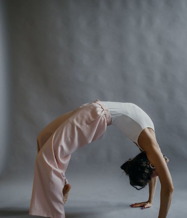 Woman in a calm yoga pose, embodying gentle movement and flexibility.